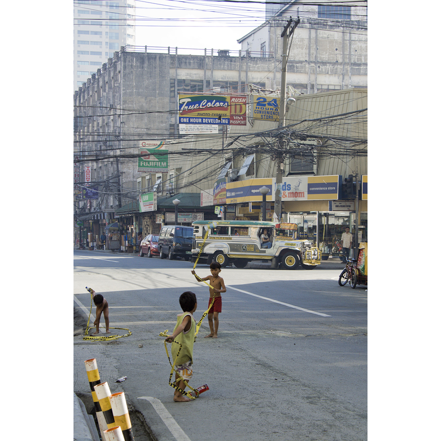 children playing, street, traffic, Manila, Philippines