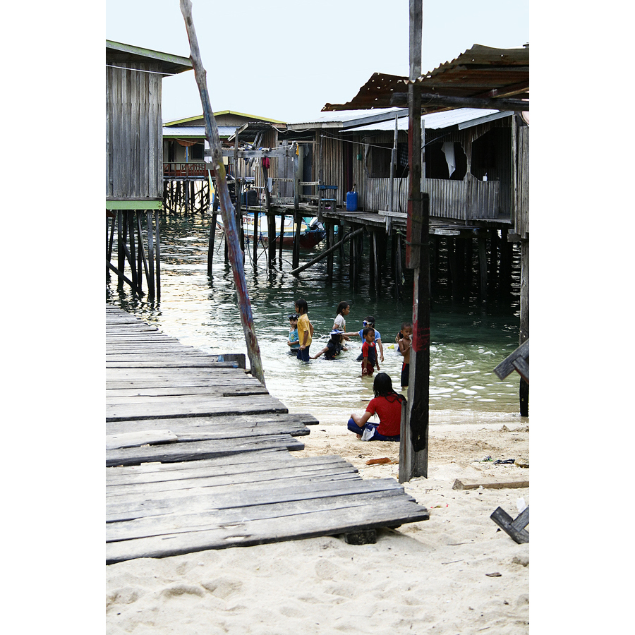 village, children swimming, Mabul, Borneo, Malaysia